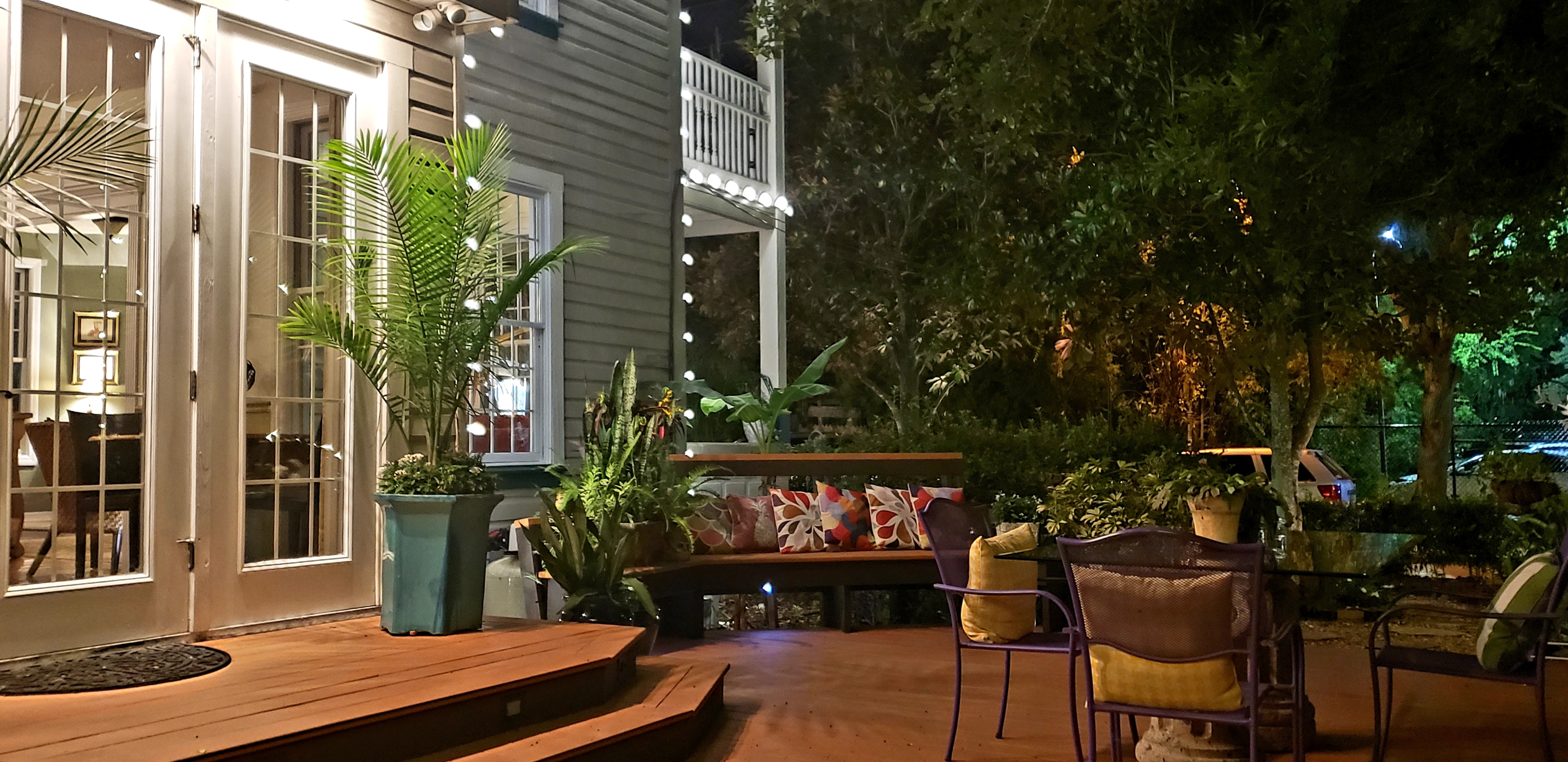 Photo of Side Deck at night of Main Inn with steps up to French doors